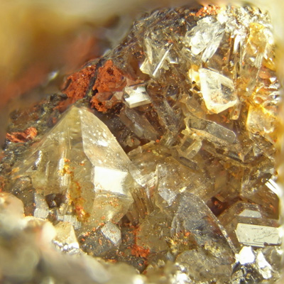 27 - Hemimorphite, cinnabar, and (?) - 3 x 3 mm.